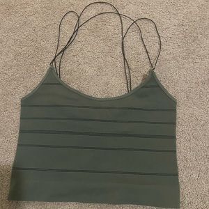 A green tank top with strips